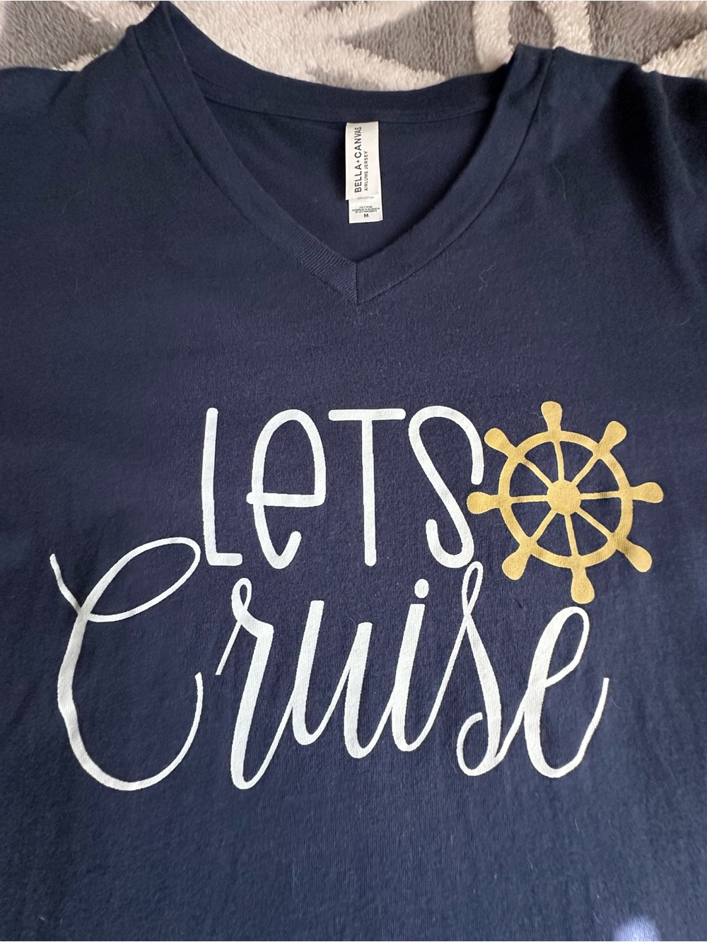 Bella Canvas Navy V-Neck Tee with White Script and Gold Wheel Graphic